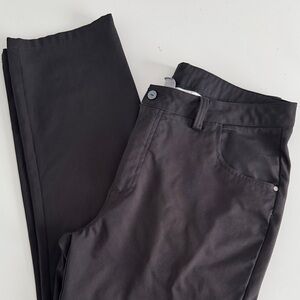 Puma 6 pocket Black with Logo button & zipper Pants. Size 36W x 32L